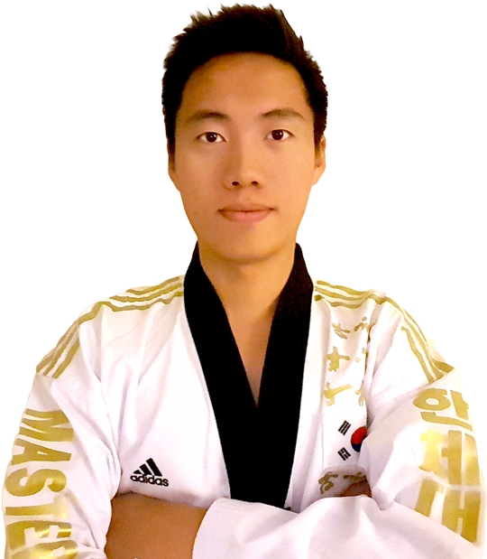 A Man In A White And Gold Karate Uniform