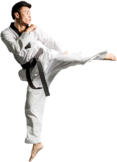 A Man In A Karate Uniform Kicking