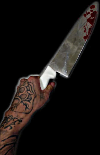 Tattooed Hand With Bloody Knife