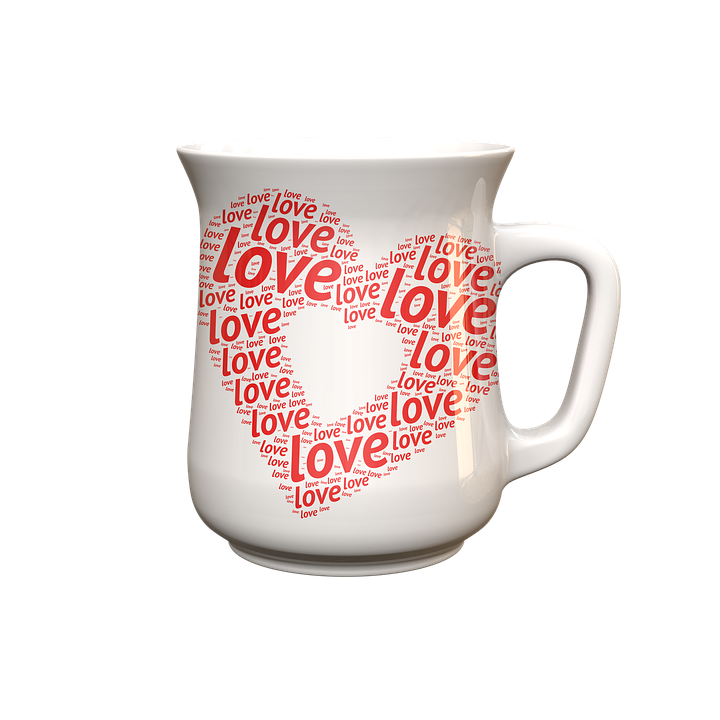 A White Mug With Red Heart On It