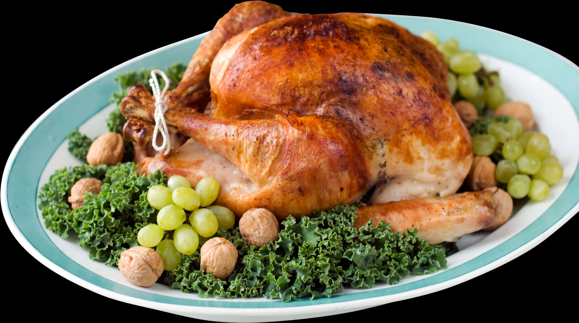 A Turkey On A Plate With Grapes And Kale