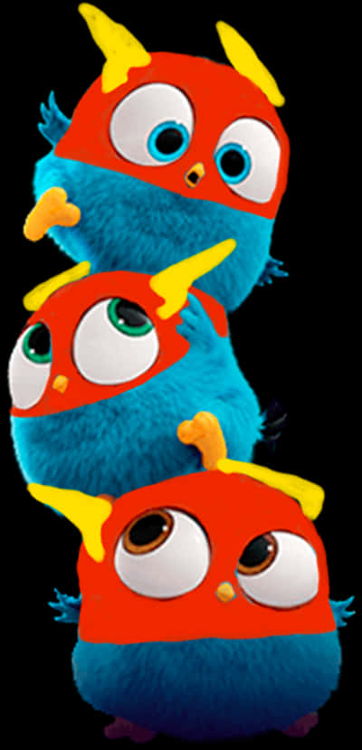 A Blue Stuffed Animal With Red Capes And Yellow Eyes