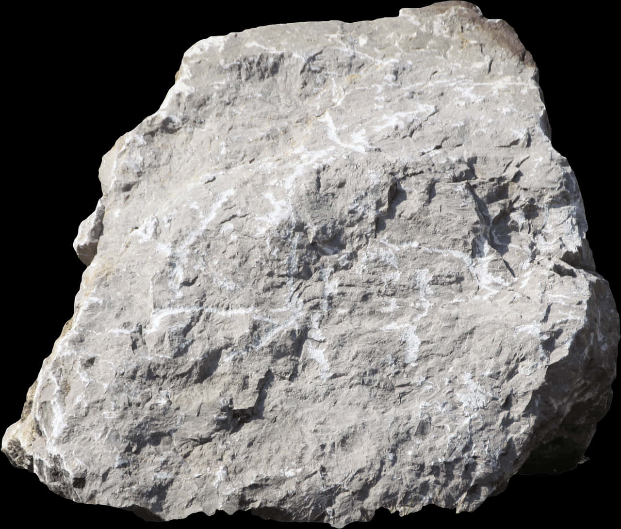A Large Rock With White Streaks On It