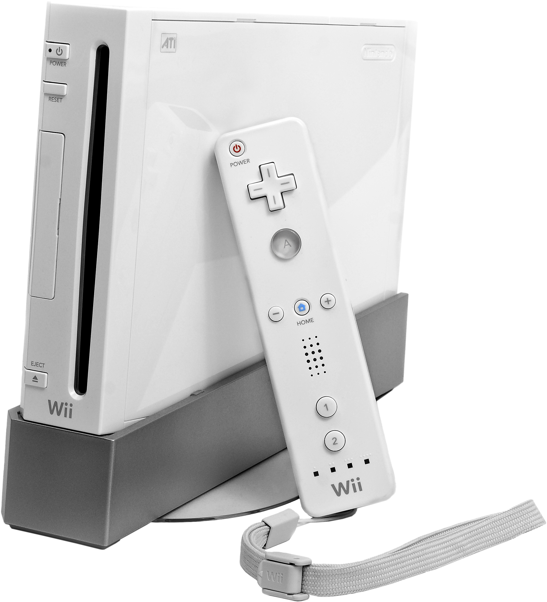 A White Video Game Console With A Remote Control