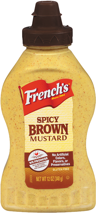A Bottle Of Mustard On A Black Background
