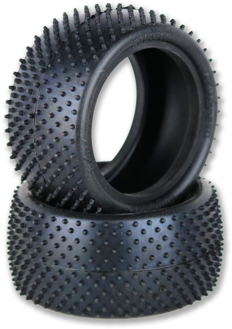 A Pair Of Black Tires With Spikes