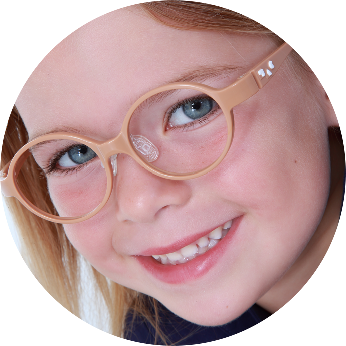 A Close Up Of A Girl Wearing Glasses