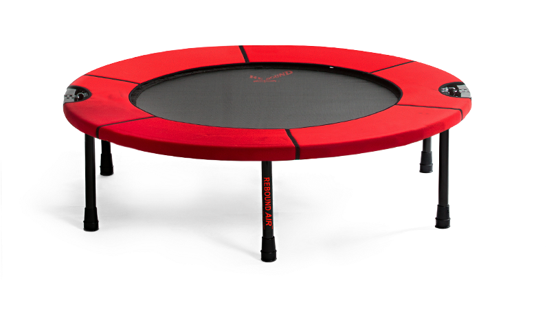 A Red Trampoline With Black Legs