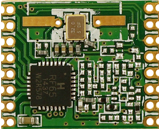 A Green Circuit Board With A Black Chip
