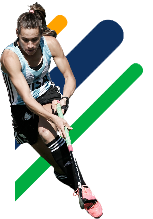A Woman In A Tank Top And Shorts Holding A Hockey Stick