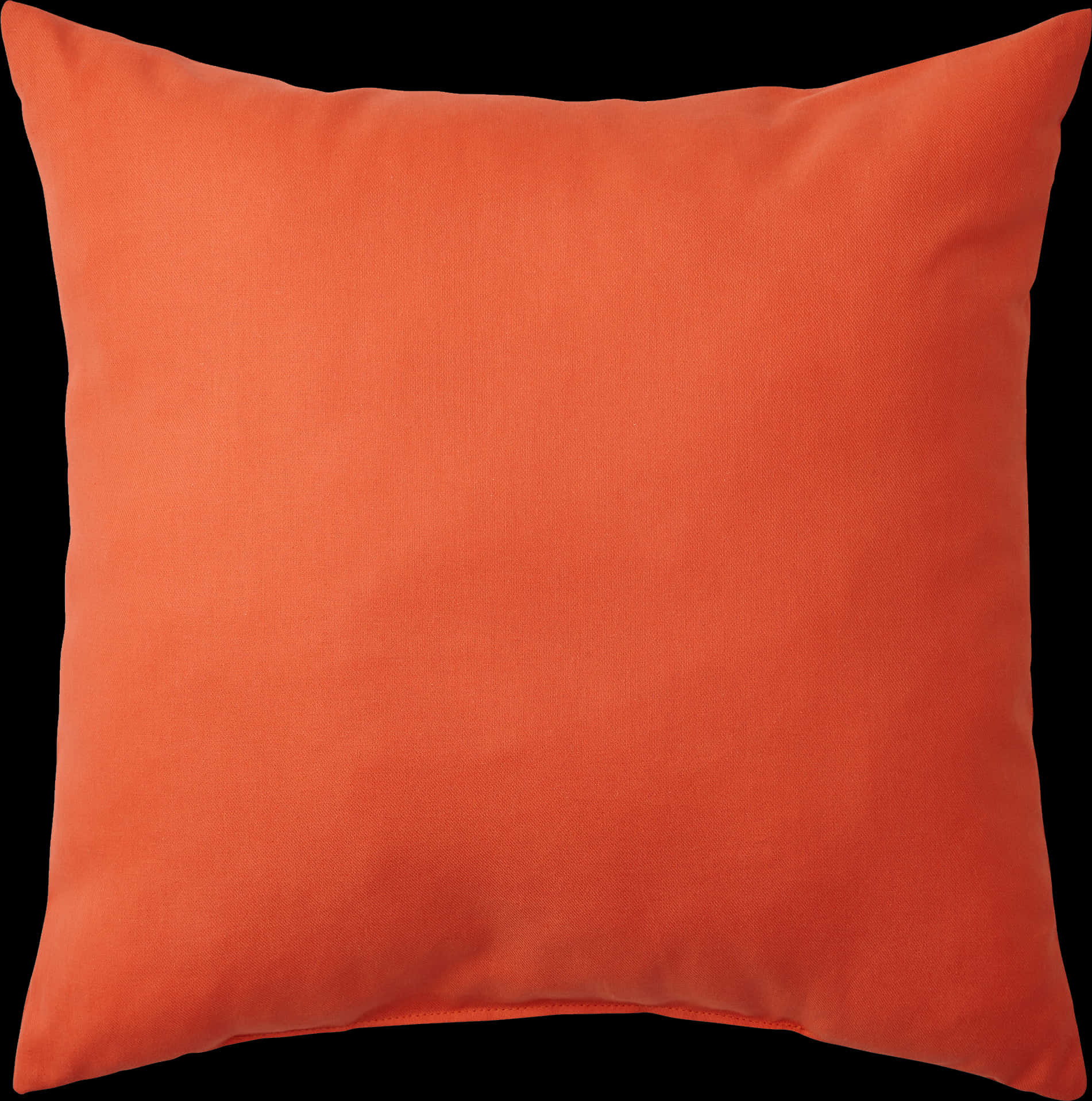 An Orange Pillow On A Black Background