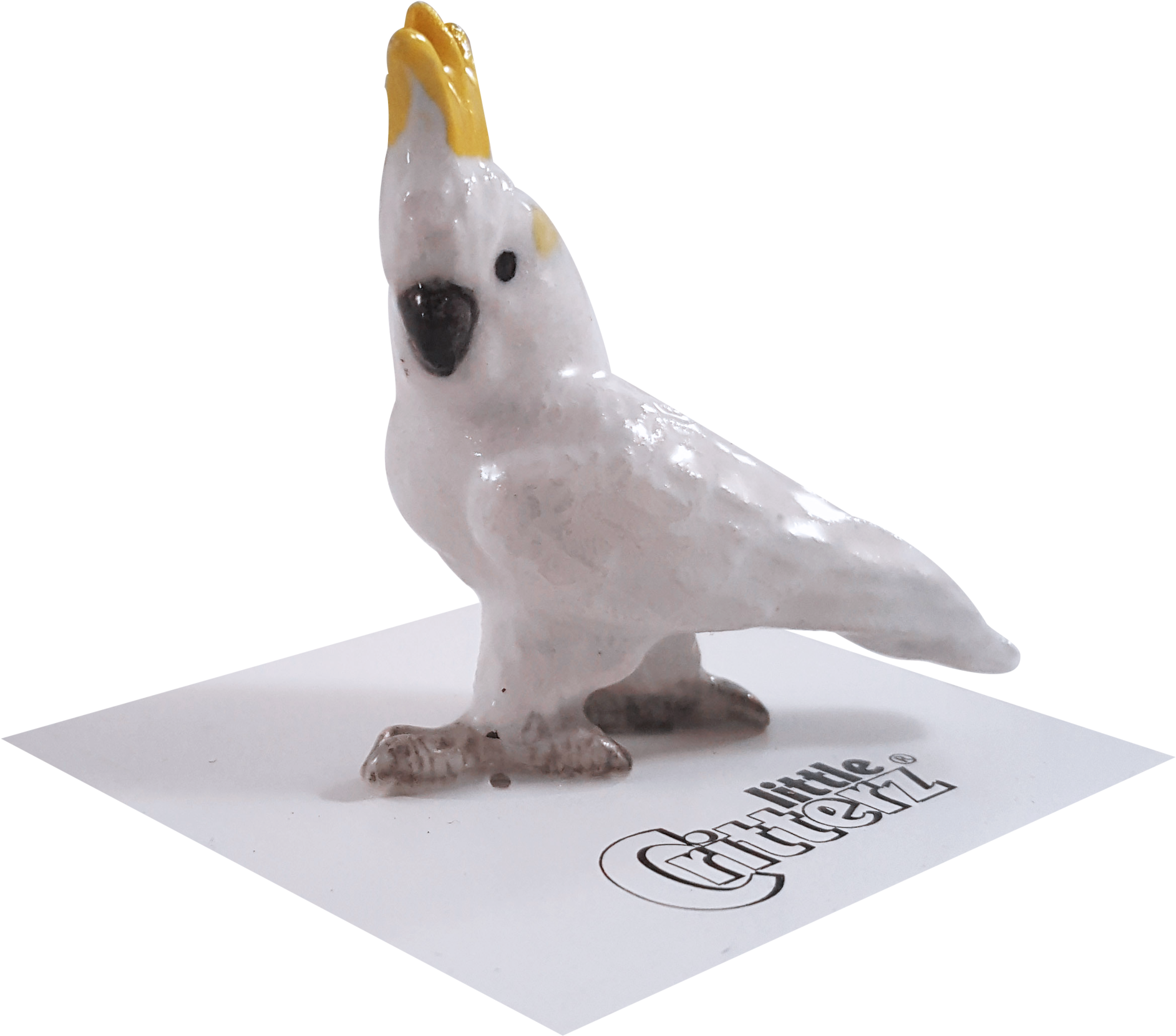 A White Bird Figurine On A White Surface