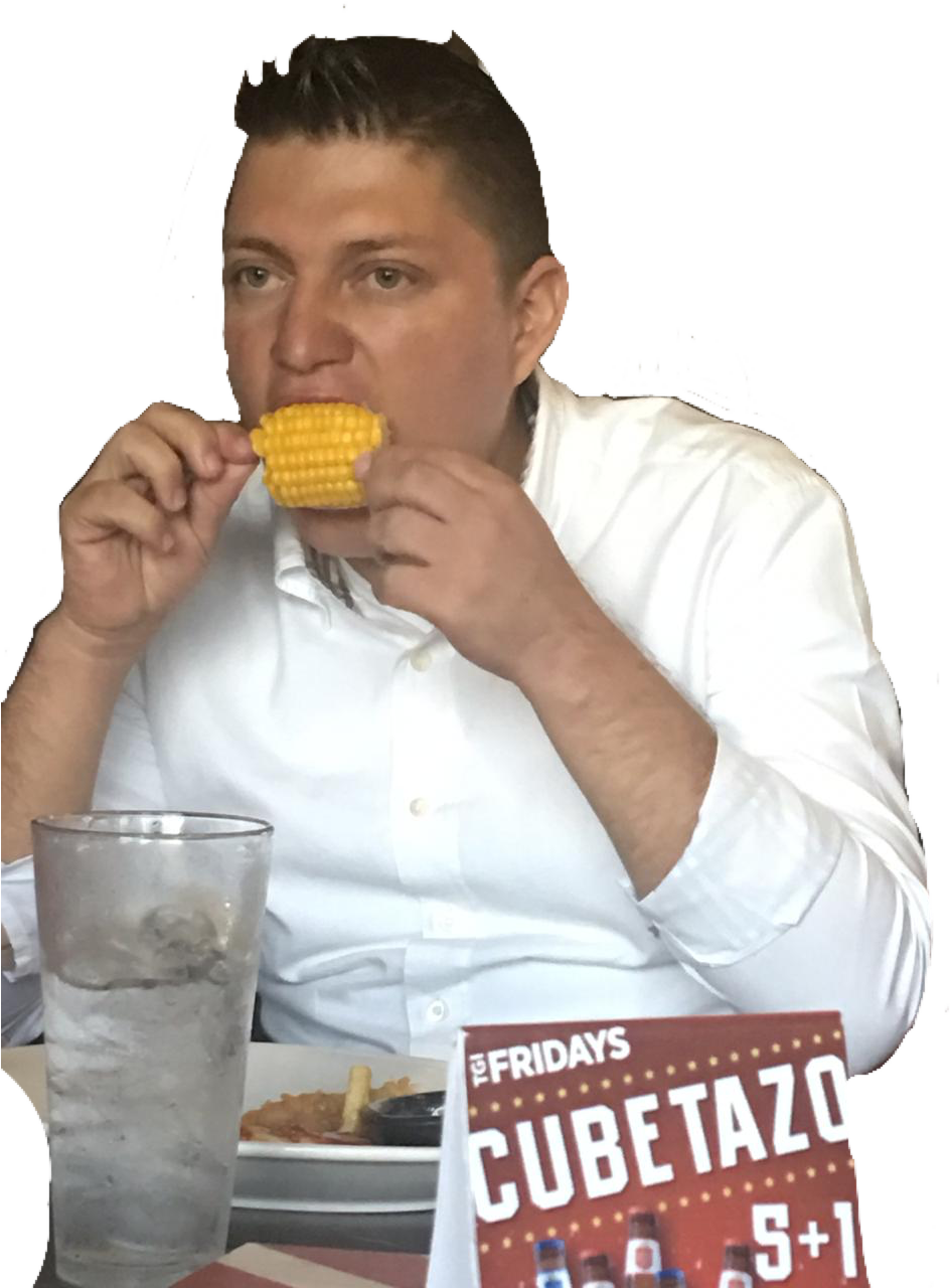 A Man Eating Corn On The Cob