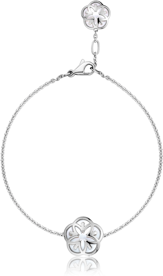 A Silver Bracelet With A Small Circle On It
