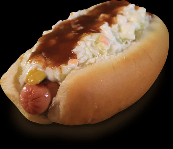 A Hot Dog With Coleslaw And Mayo On Top