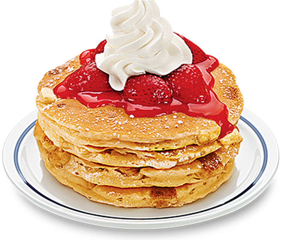 A Stack Of Pancakes With Strawberries And Whipped Cream