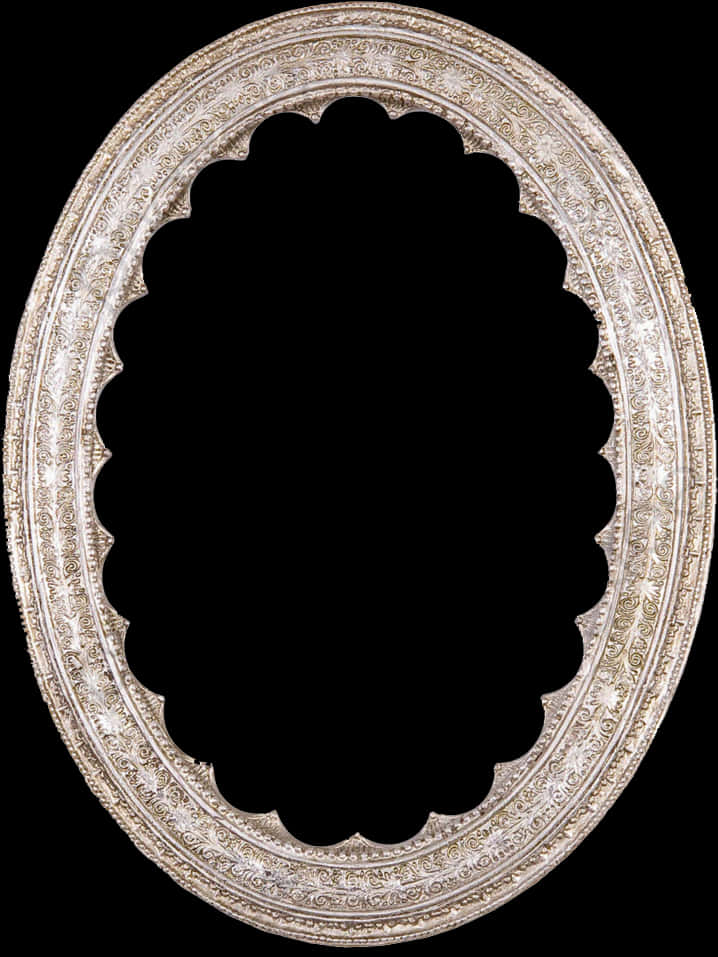 A Silver Oval Frame With A Black Background