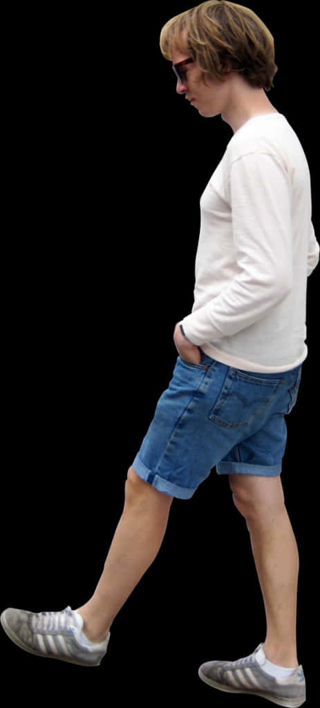 A Man In A White Shirt And Blue Shorts