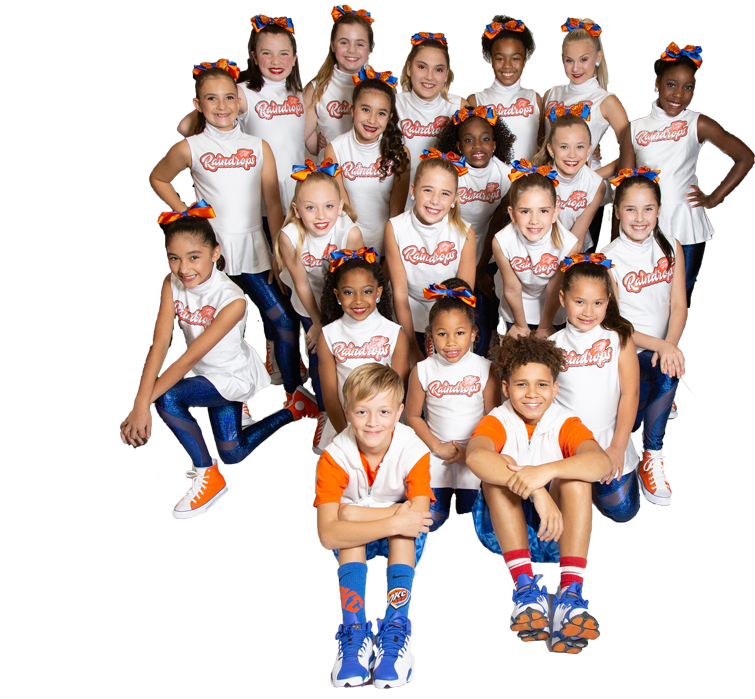A Group Of Cheerleaders Posing For A Photo