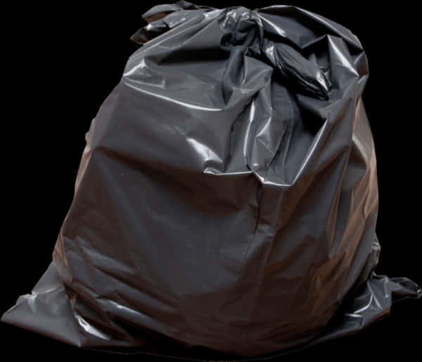 A Black Garbage Bag On A Black Background