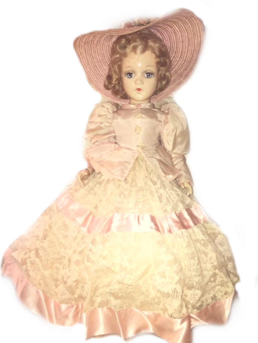 A Doll In A Dress And Hat