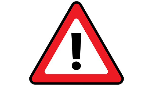 A Red And White Triangle Sign With A Black Exclamation Mark