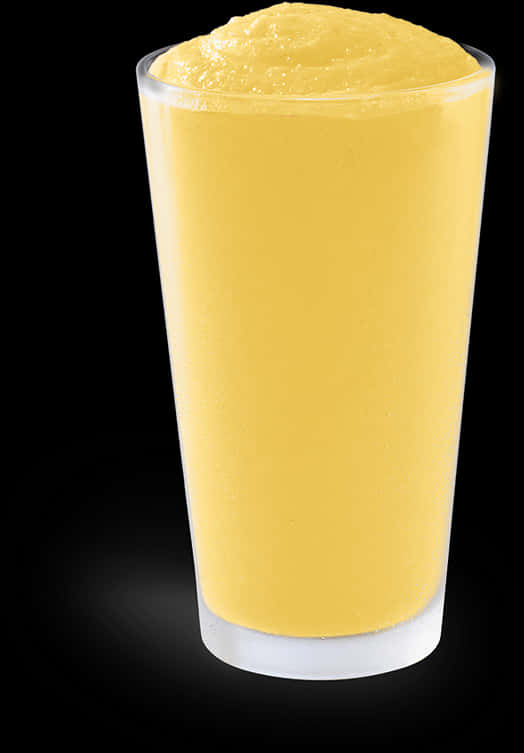 A Glass Of Yellow Liquid