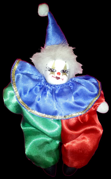 A Clown Doll With A Blue And Red Outfit