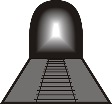 A Train Track Leading To A Light