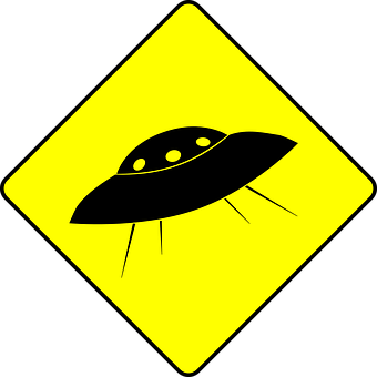 A Yellow Sign With A Black Object On It