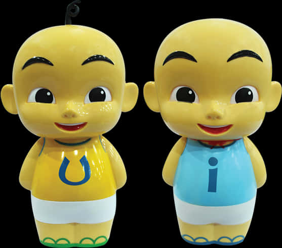Two Plastic Dolls With Different Colors