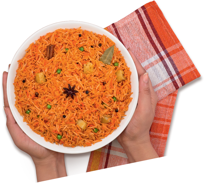 A Bowl Of Rice With Vegetables And Spices