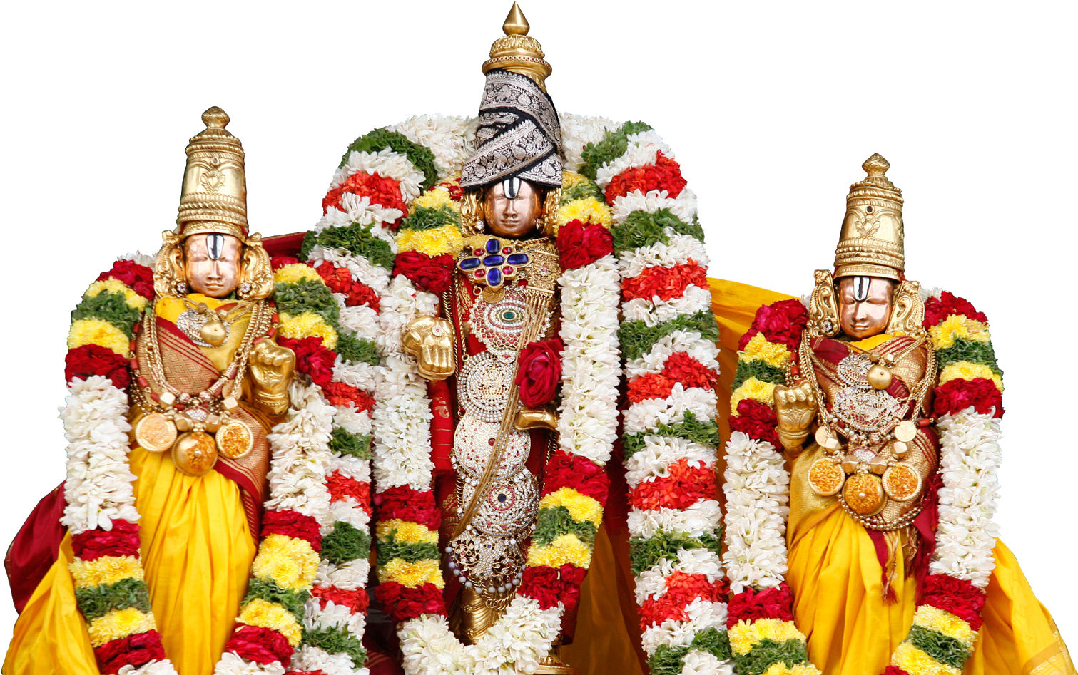 A Group Of Statues With Flowers With Venkateswara Temple, Tirumala In The Background