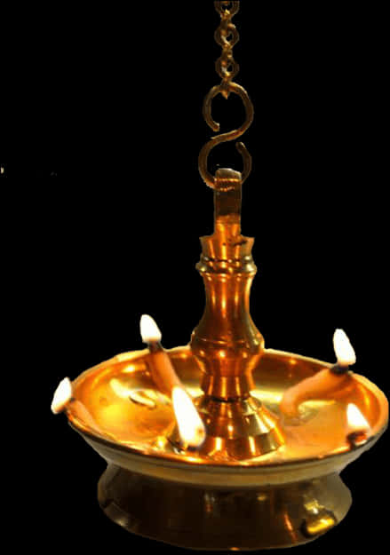 A Gold Candle Holder With Lit Candles