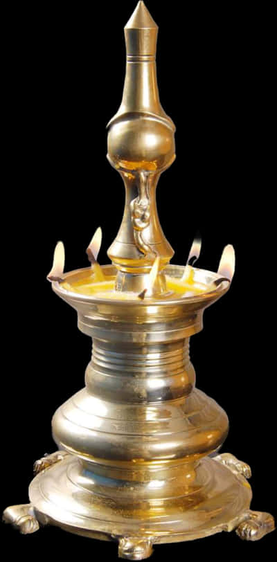 A Gold Candle Holder With Lit Candles