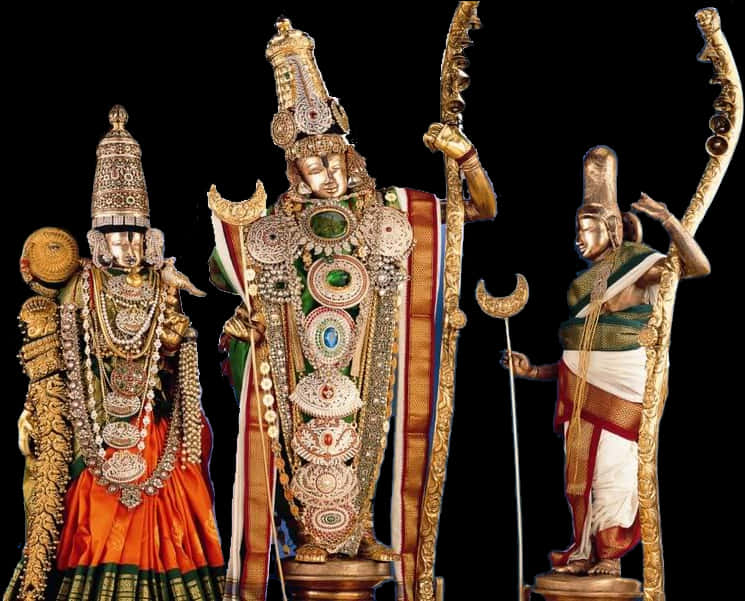 A Group Of Statues With Gold And Silver Decorations