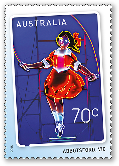 A Stamp With A Cartoon Image Of A Girl Jumping On A Rope