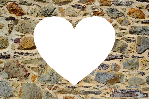 A Heart Shaped Hole In A Stone Wall