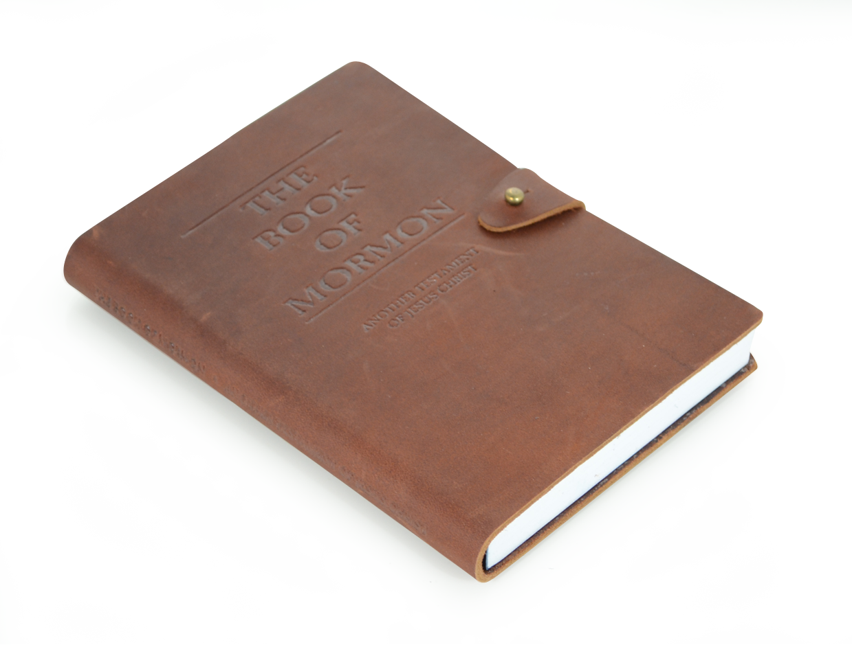 A Brown Leather Book With A Button