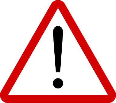 A Red And White Triangle Sign With A Exclamation Mark