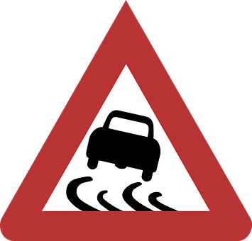 A Red Triangle Sign With A Black Car On It