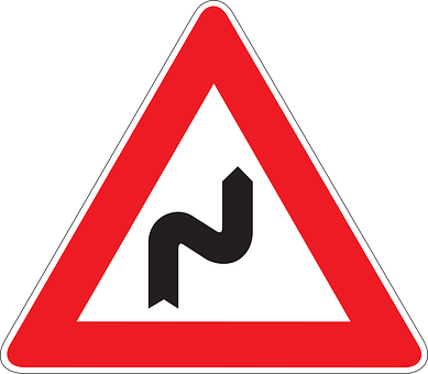 A Red Triangle Sign With Black Text