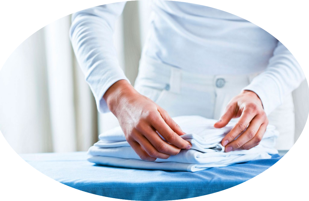 A Person Folding A Folded White Shirt