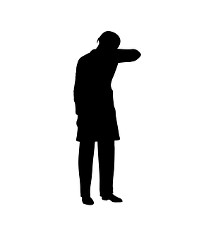 A Silhouette Of A Man With His Hand To His Face