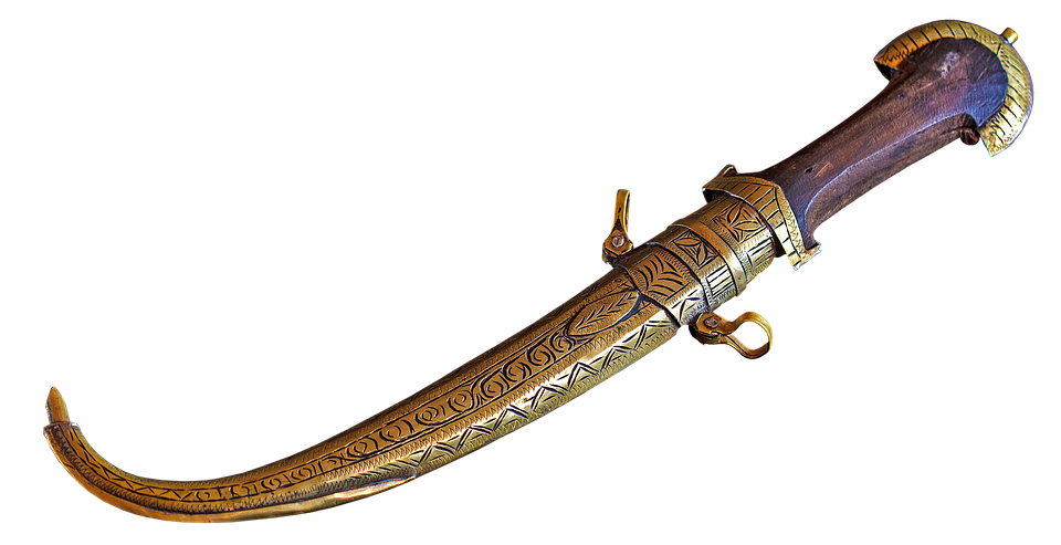 A Gold Knife With A Handle