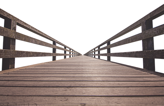 A Wooden Bridge With Railings