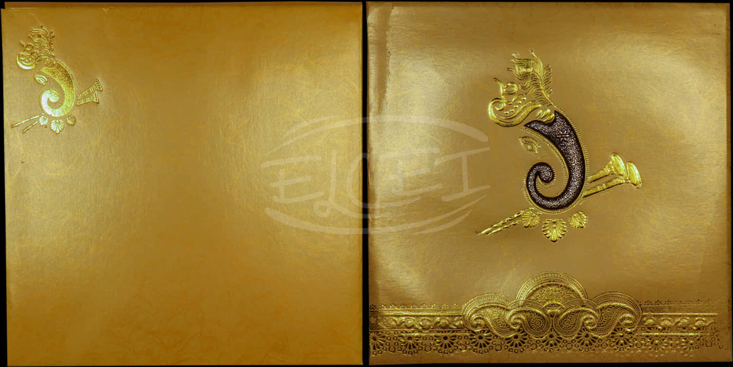 A Gold Book With A Design On It