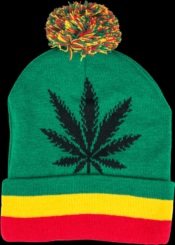 A Green And Yellow Beanie With A Leaf On It