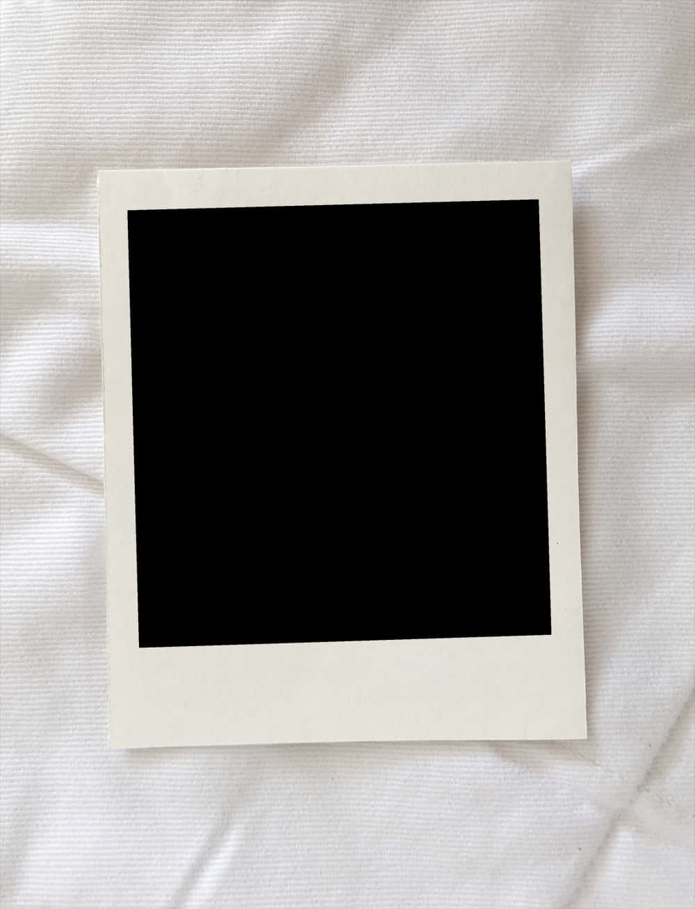 A Polaroid On A White Cloth