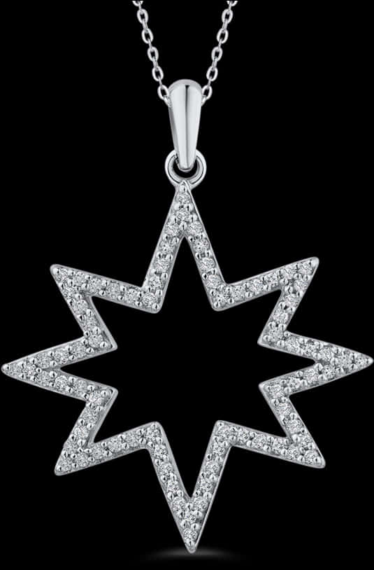 A Diamond Star Necklace On A Black Background